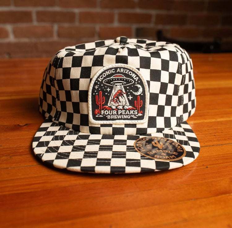 Checkerboard hat with an Iconic Arizona and Four Peaks Brewing UFO patch