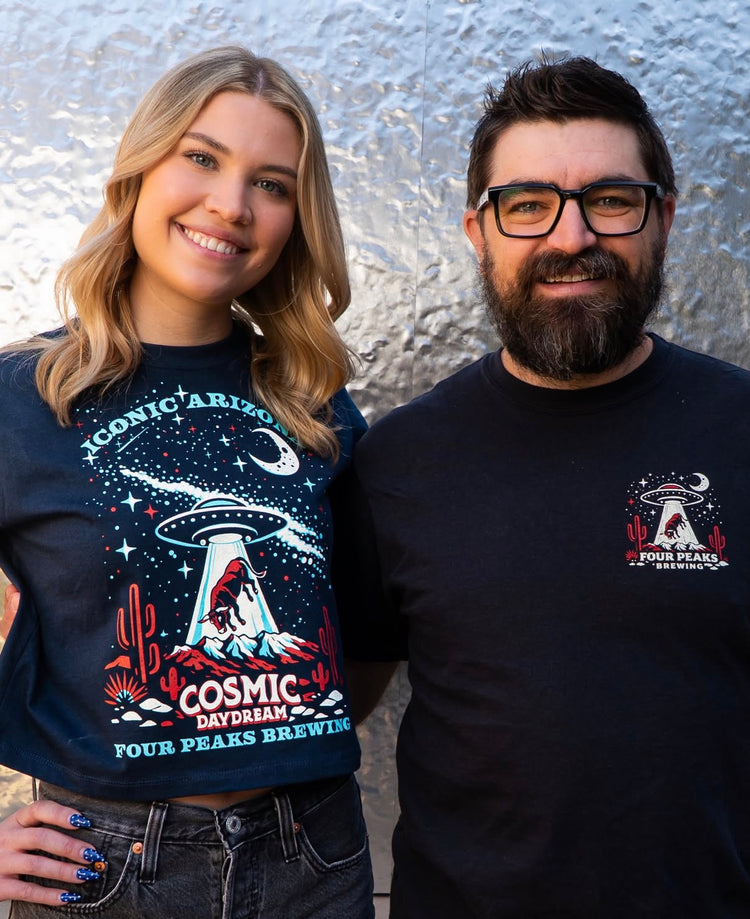 A woman and man wearing Iconic Arizona and Four Peaks Brewing Cosmic Daydream collab shirts